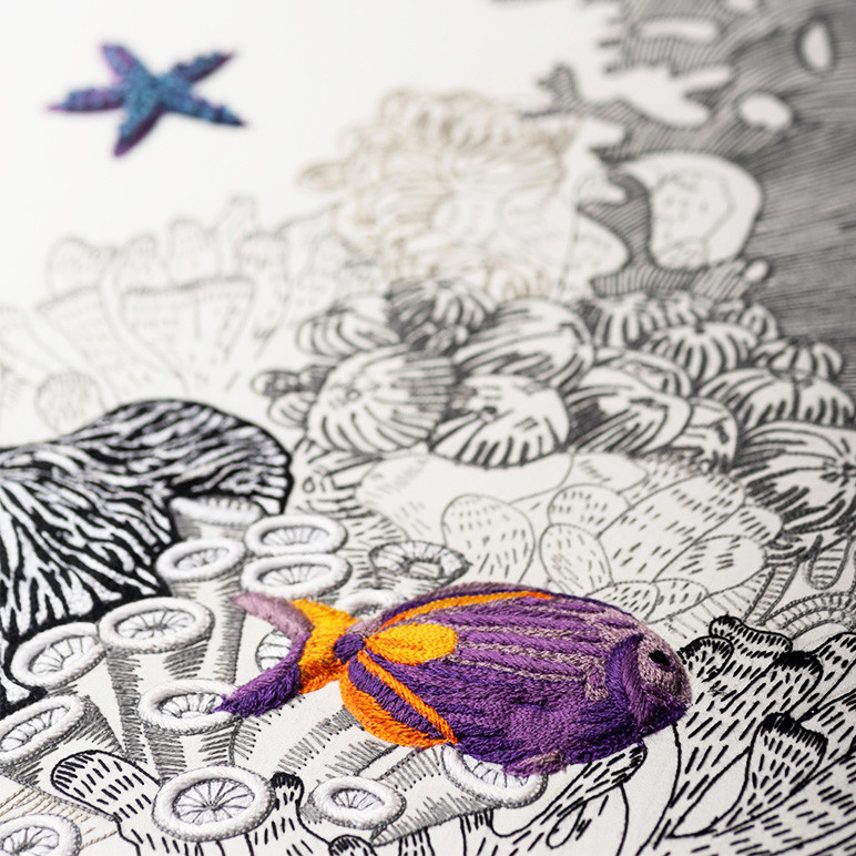 modern embroidery art detail of a fish wall art piece