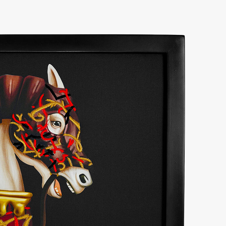 corner view of a framed original artwork showcasing a war horse embellished in thread