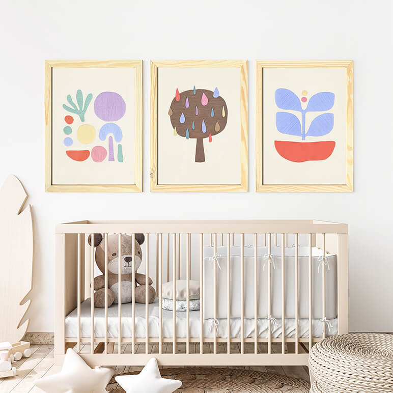 Nursery room with three abstract pastel wall artworks, embroidered and framed in wood