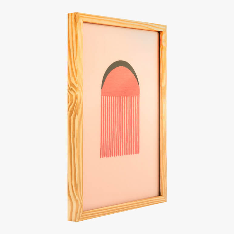 side angle view of a framed pink textile wall artwork