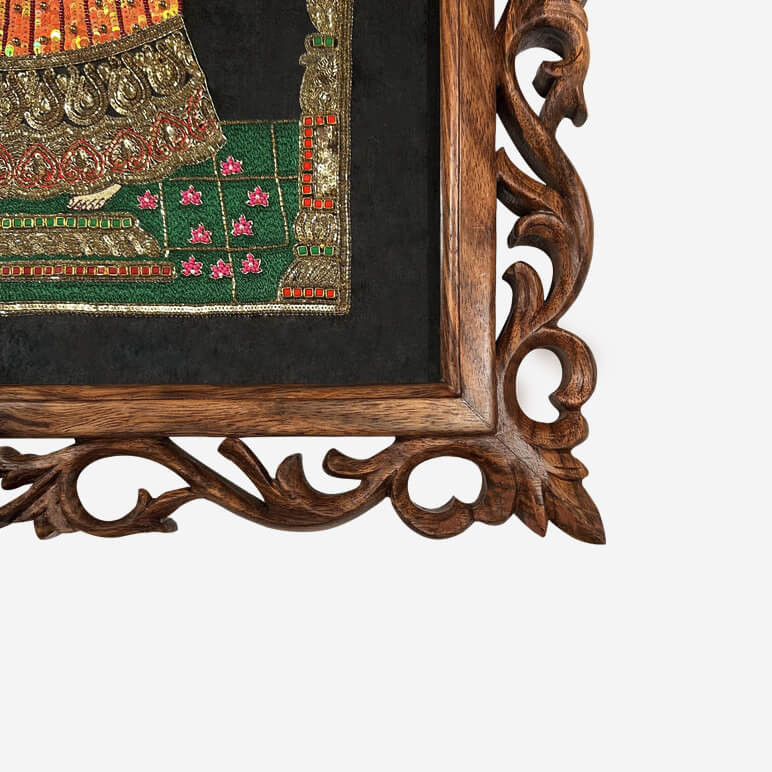 Corner of a hand carved ornate dark wood frame