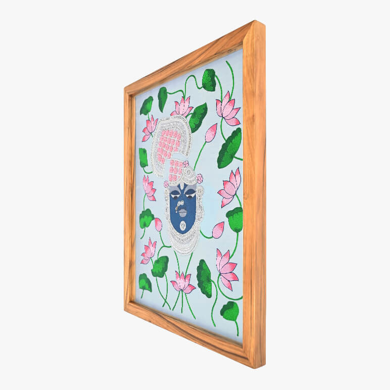 Right angled view of a Shrinathji artwork, framed in wood