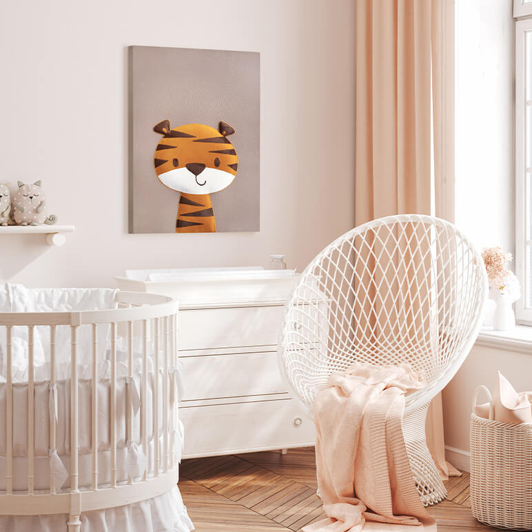 staged image of a tiger wall art piece seen in a pink nursery room