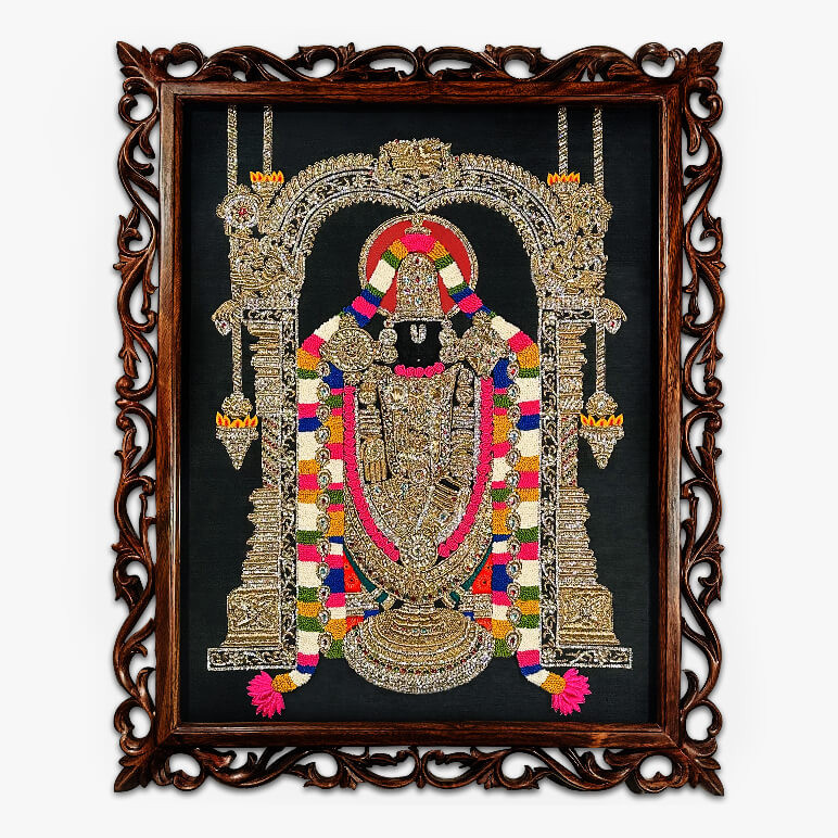 Feature image showcasing Lord Sri Venkteswara in a textile artwork with vibrant colours of gold, pink, red, black and white over a black fabric background; framed in a hand-carved oak wood frame