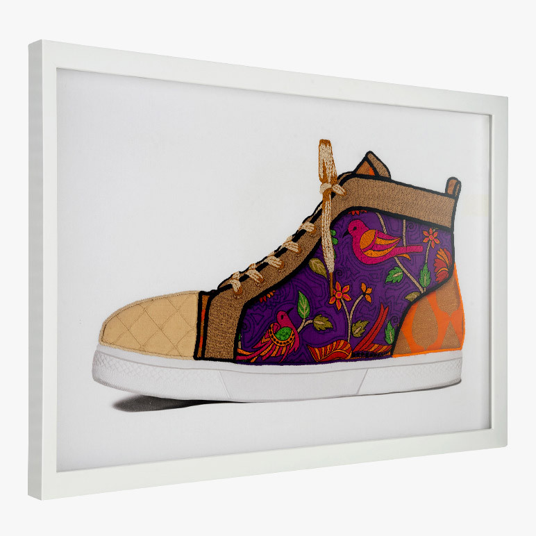 framed bright wall artwork with a purple sneaker
