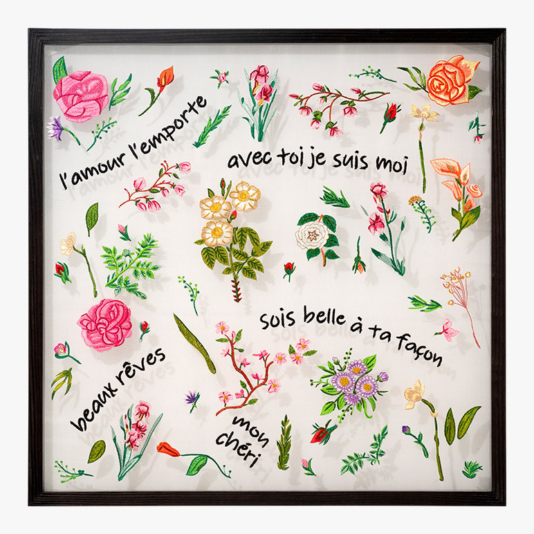 french country wall art with delicate florals and motivational phrases embroidered in thread