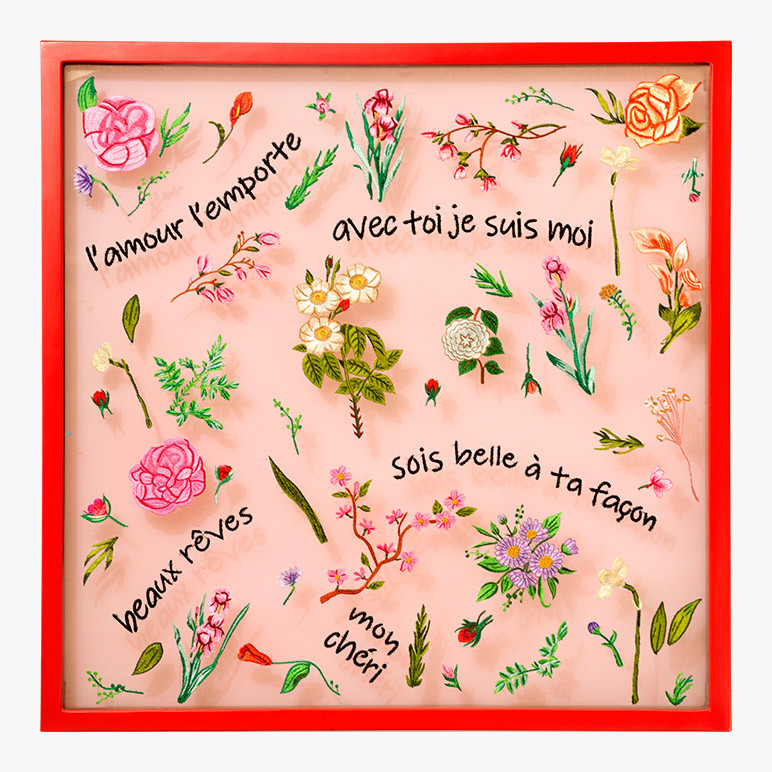 framed romantic wall art with French phrases and delicate florals embroidered over organza fabric