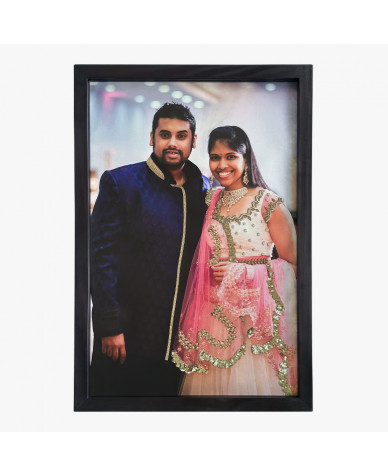 unique anniversary gift showing a young couple, framed in black wood